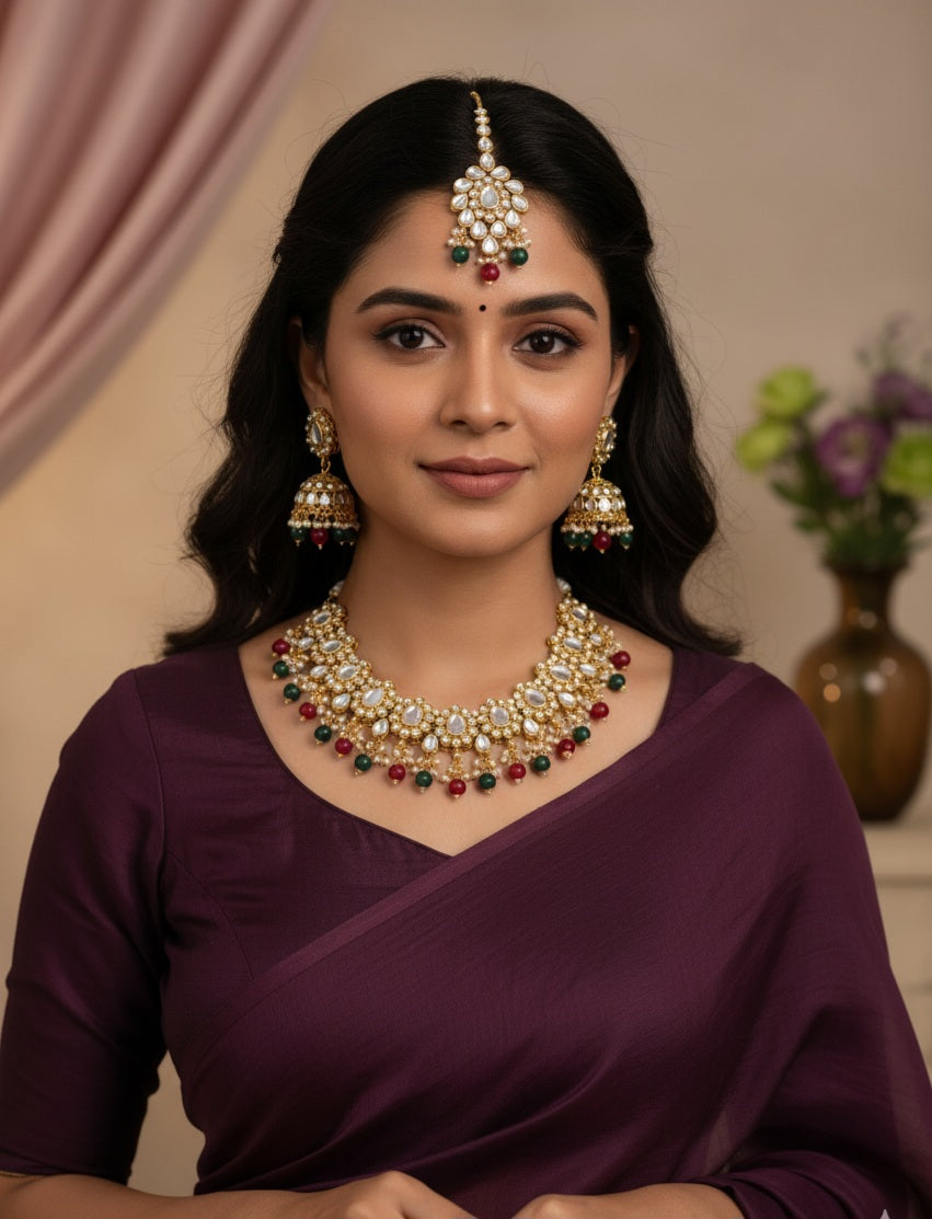 Itrani Royal Heritage Kundan Necklace Set – Red & Green Beaded Bridal Jewelry with Maang Tikka (Anti-Tarnish Brass)