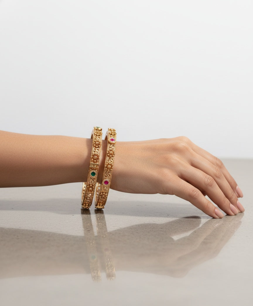Itrani Antique Gold Brass Bangles with Multicolor Stones and Swastik Design – Traditional Festive Jewelry
