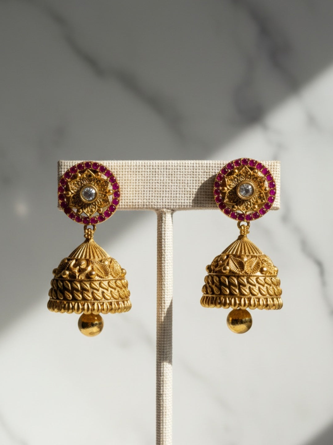 Itrani Gold-Polish finishing Ruby Synthetic Stone Temple Jhumka Earrings | Handcrafted Traditional Design
