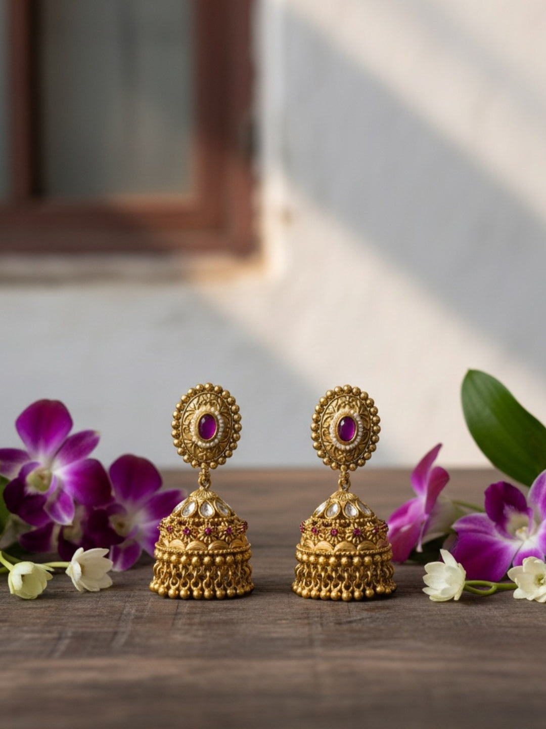 Itrani Royal Heritage Gold Polish finishing Jhumka Earrings with Ruby Stone Accents
