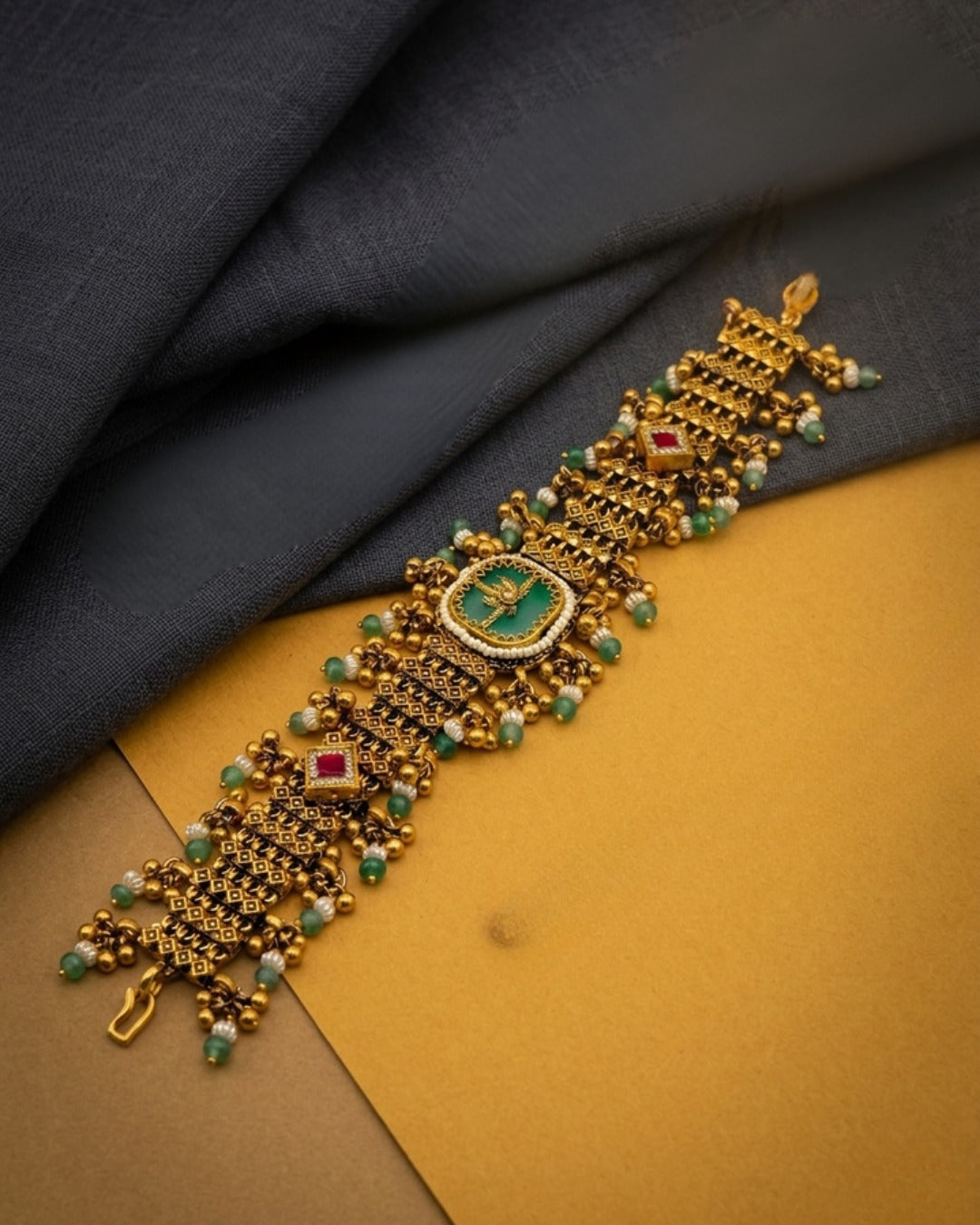 Itrani Rajwadi Heritage Ethnic Gold Plated Bracelet With Glass Center Stone.