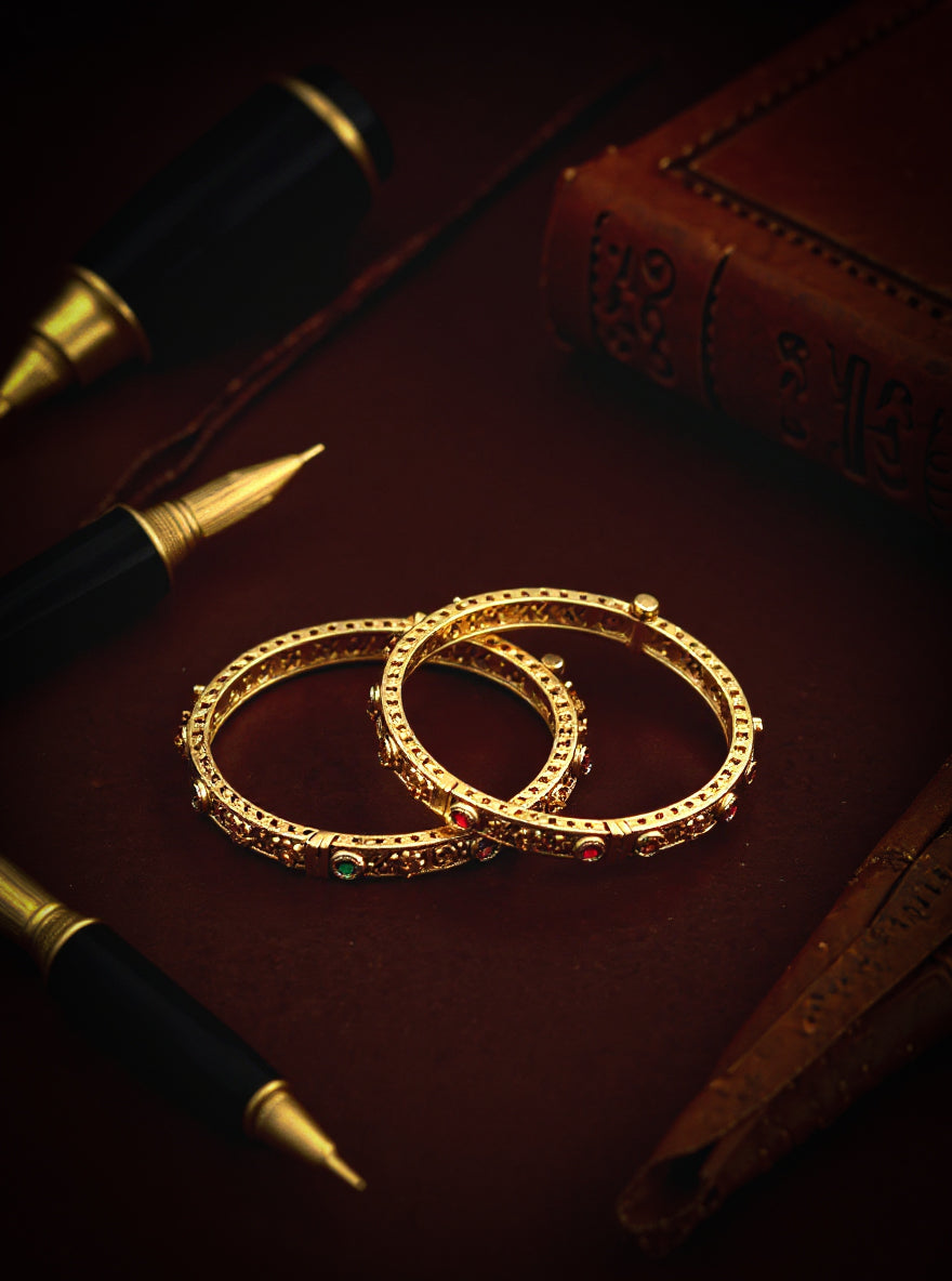 Itrani Antique Gold Brass Bangles with Multicolor Stones and Swastik Design – Traditional Festive Jewelry
