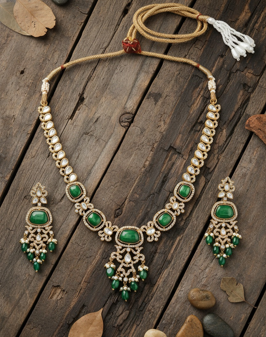 Itrani Aarohi Emerald Green Stone Clear Polki Stone Necklace Set – Traditional Brass Jewelry with Modern Elegance