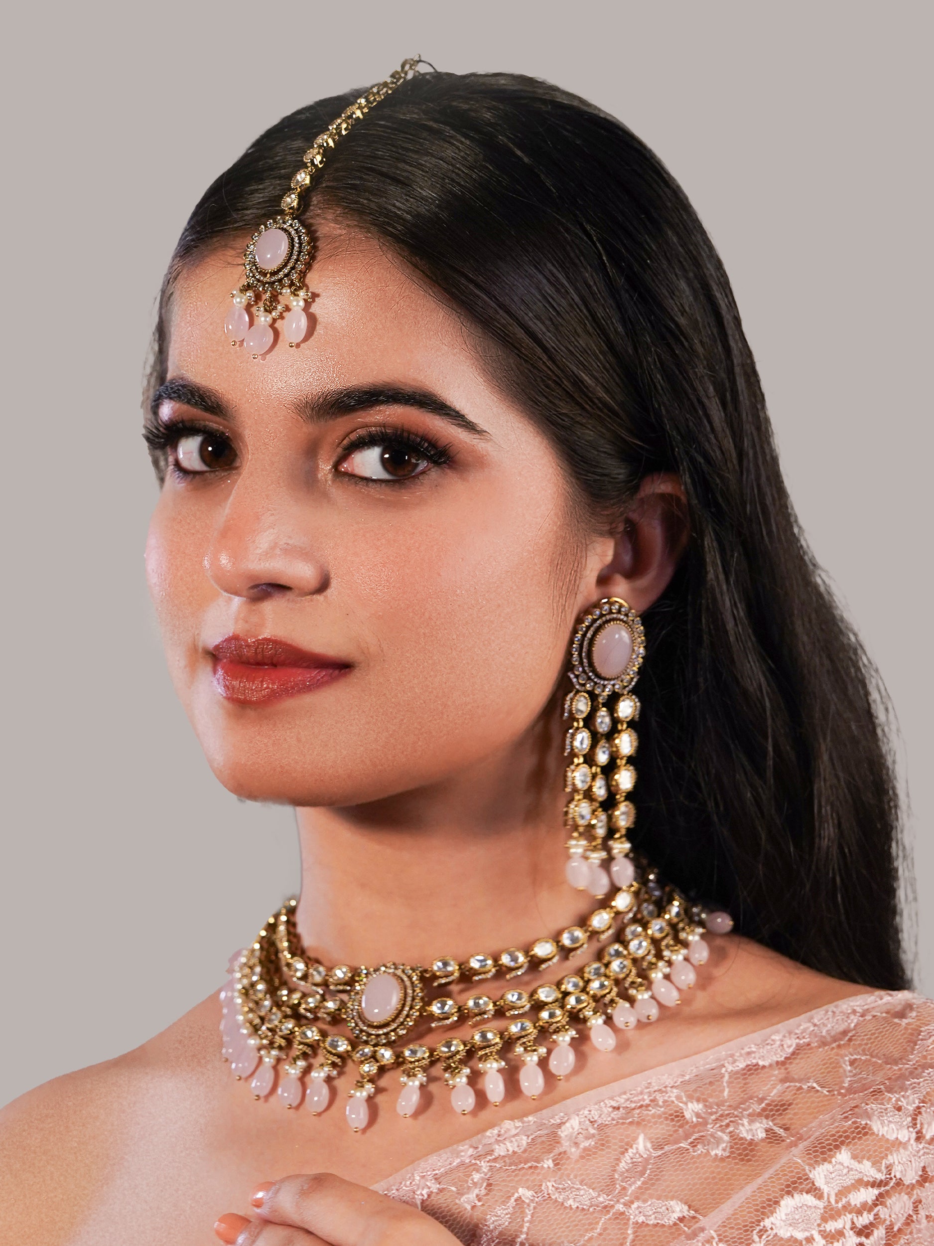 Itrani three layers Clear Polki Stone with Pink Drops Necklace Set – Traditional Brass Jewelry with Earrings & Maang Tikka