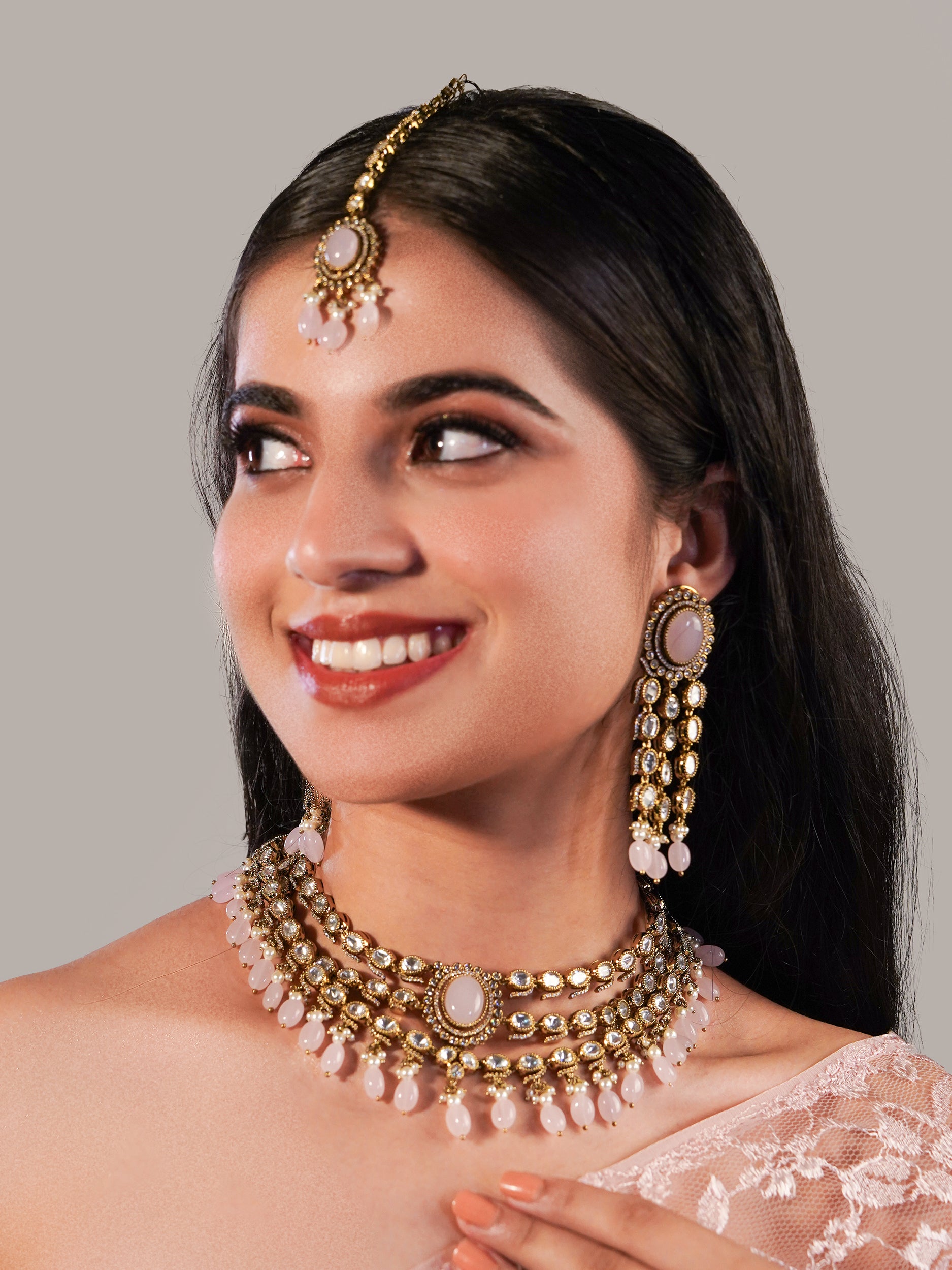 Itrani three layers Clear Polki Stone with Pink Drops Necklace Set – Traditional Brass Jewelry with Earrings & Maang Tikka