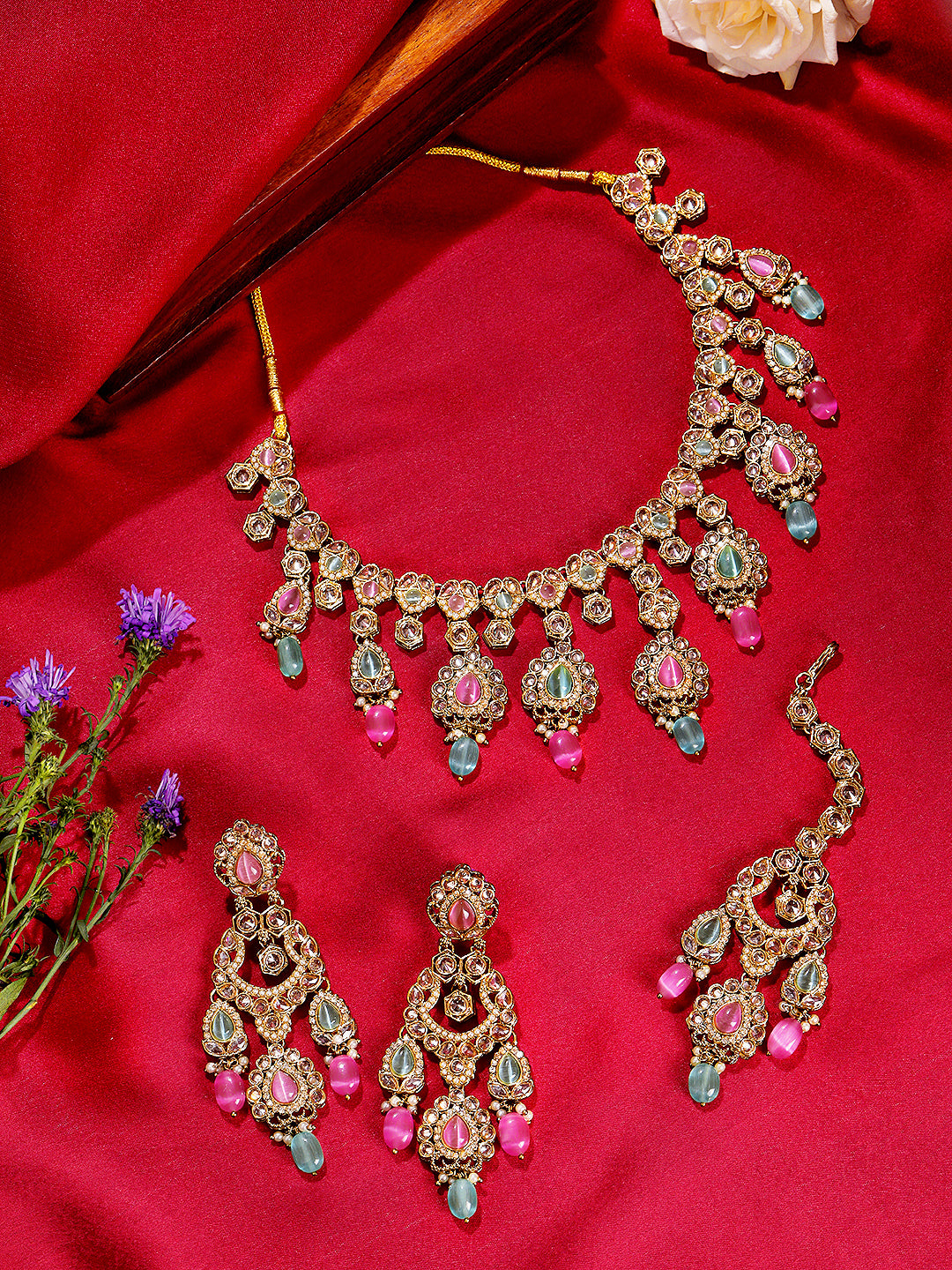 Itrani Pastel Royalty Reverse AD Stone Necklace Set – Pink & Pista Green Stones with Jhumka Earrings & Maang Tikka
