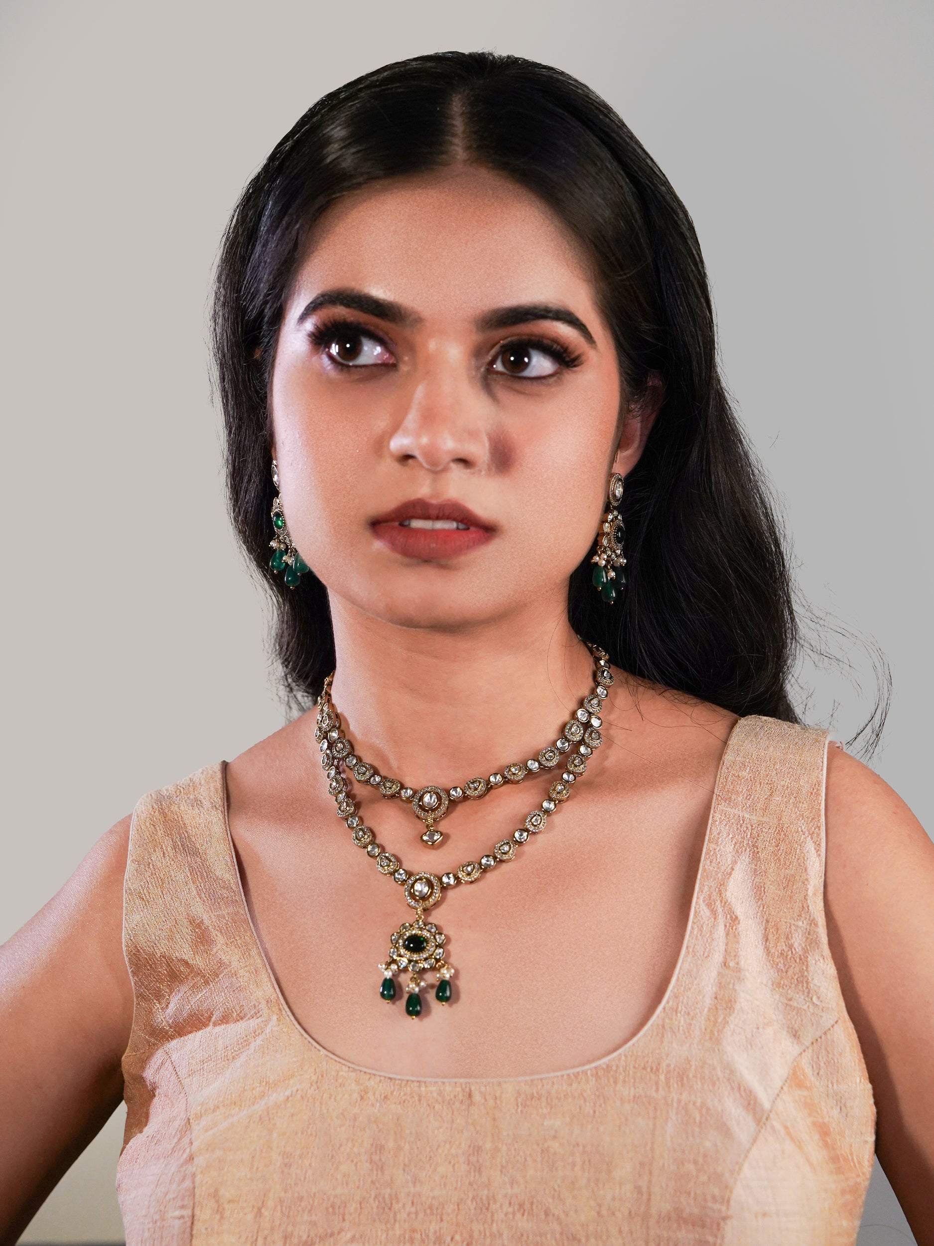 Itrani Noor Emerald Green Droplets with Emerald centre Stone Necklace Set – Dual Layer Antique Brass Finish