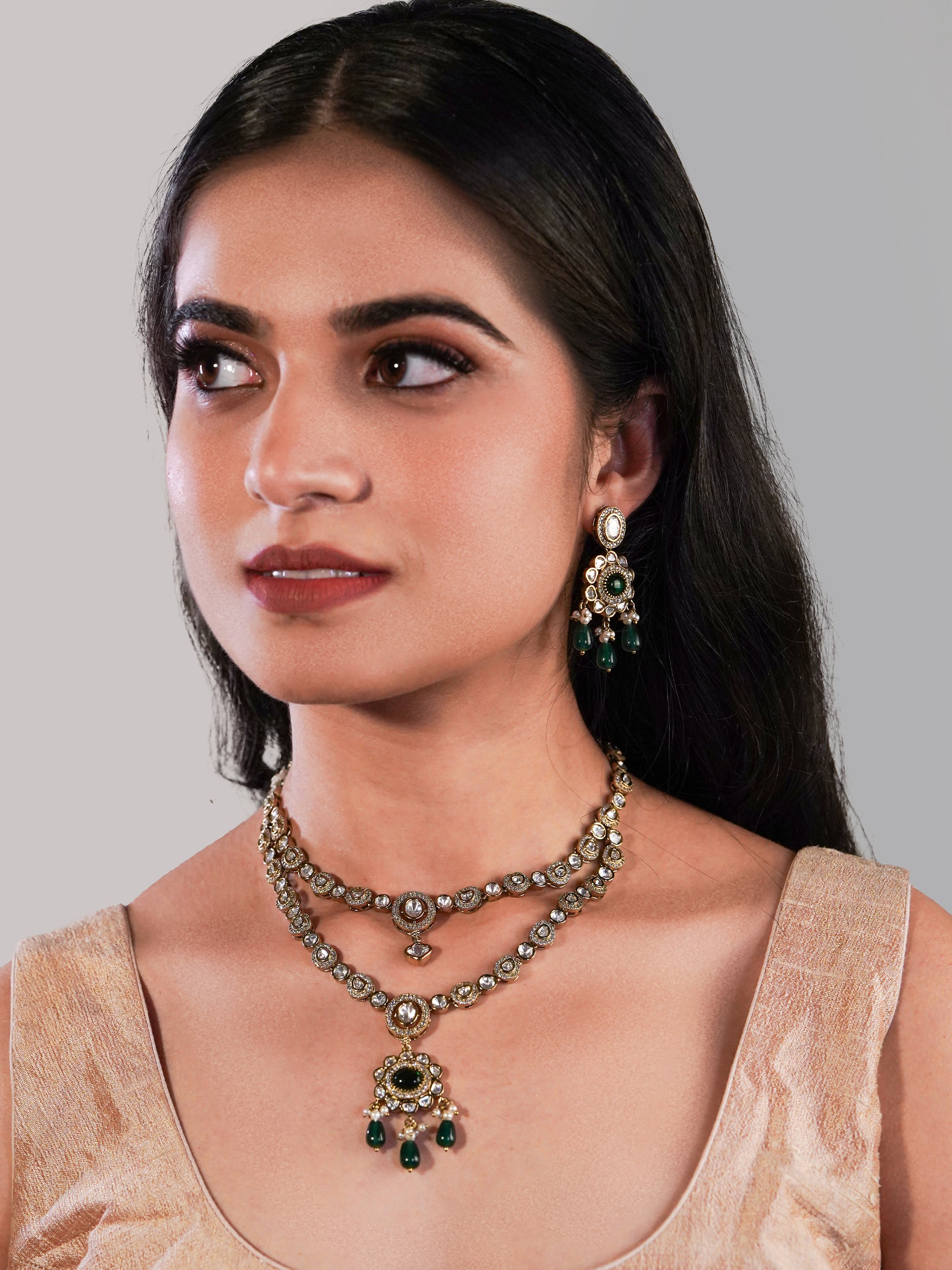 Itrani Noor Emerald Green Droplets with Emerald centre Stone Necklace Set – Dual Layer Antique Brass Finish